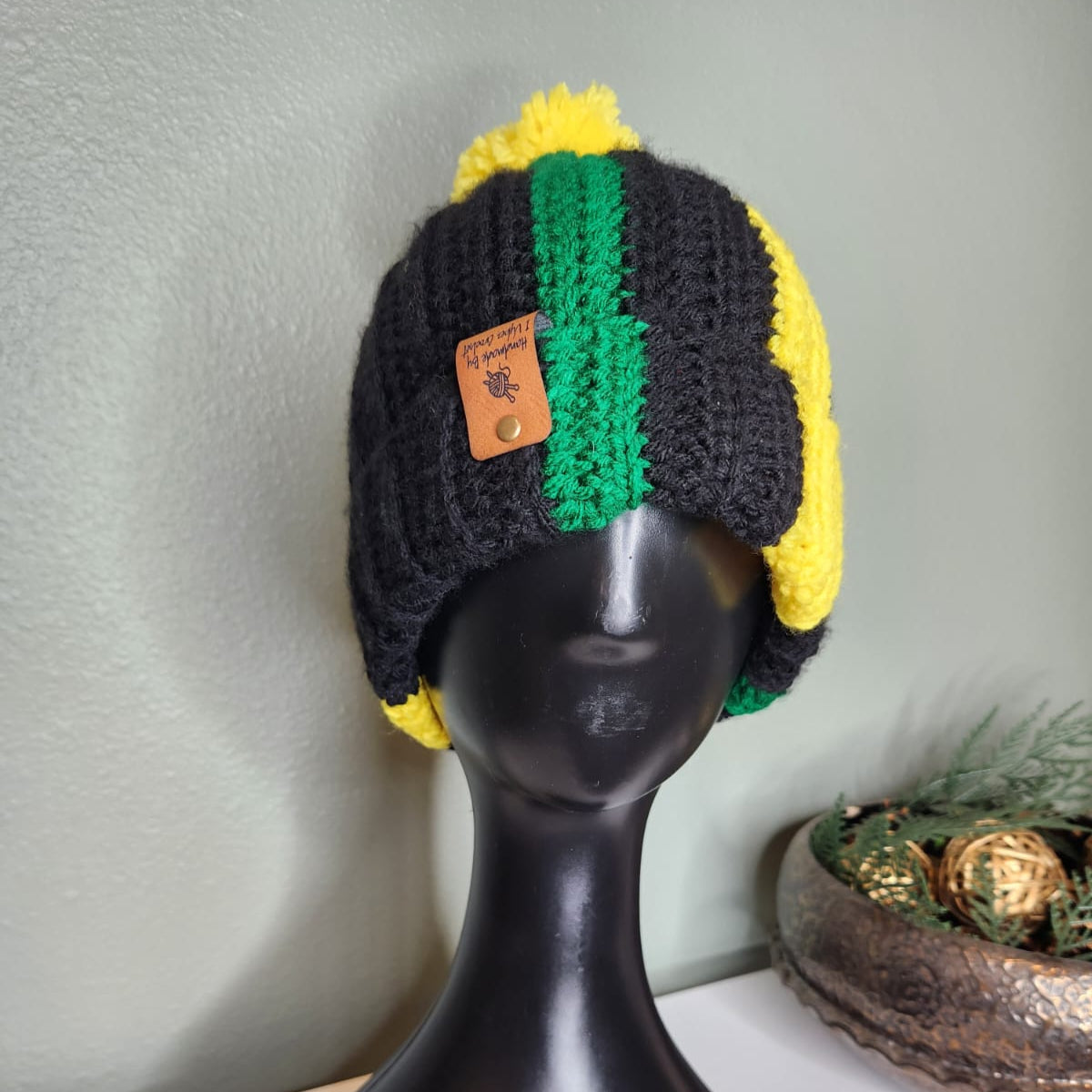 Black, green and yellow handmade crochet beanie. Winter hat.